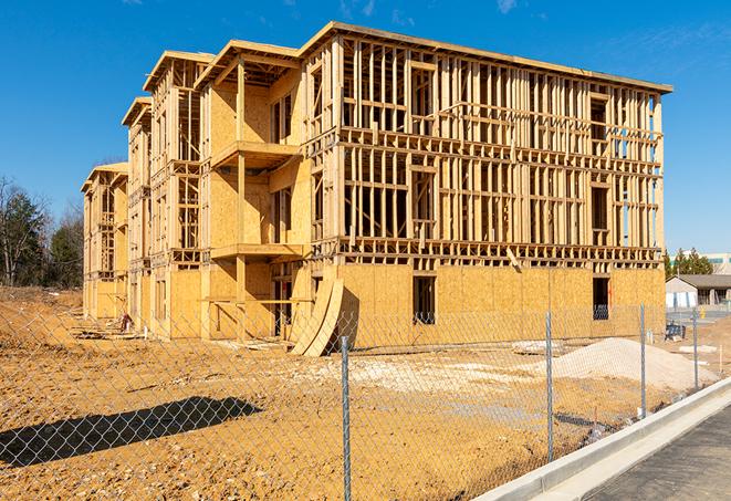 construction zone secured with a temporary fence, marked with warning signs in Lakeville, IN